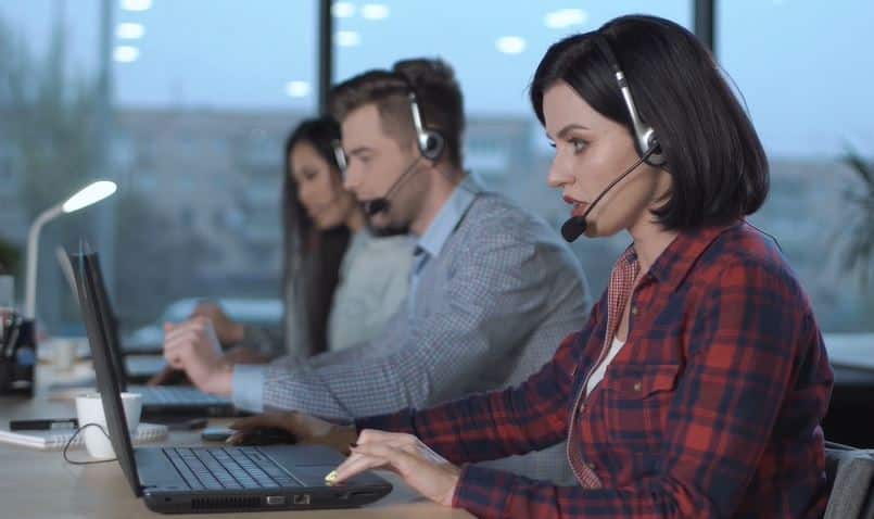 Call centre staff with headsets
