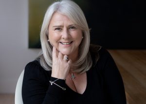 woman smiling with silver hair