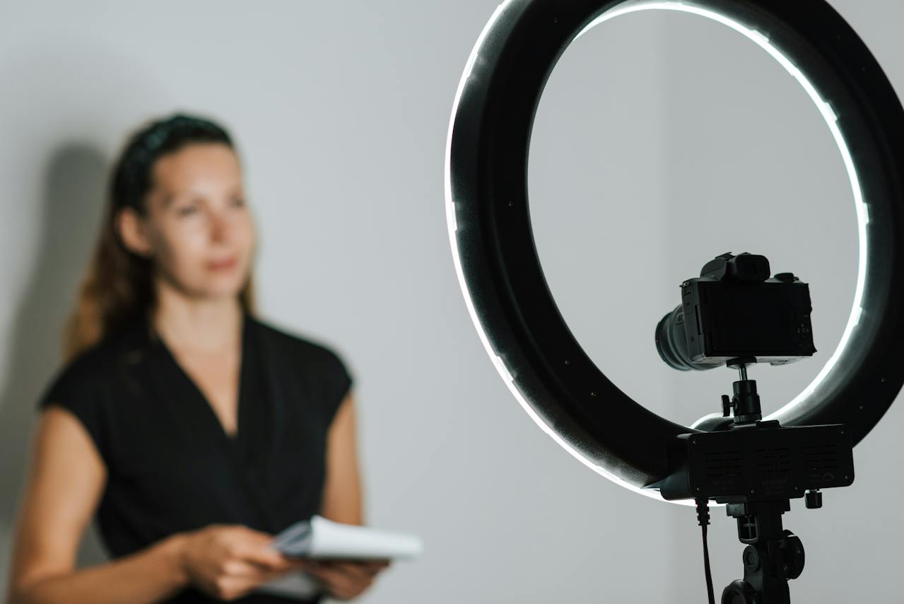 woman using ring light to record a video 